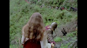 Movie still from “My Best Fiend” (1999), directed by Werner Herzog – A woman with long brown hair is holding a sword; Medium shot, High angle