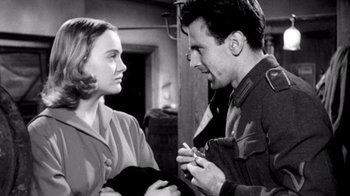 Movie still from “My Best Fiend” (1999), directed by Werner Herzog – A man and a woman talking to each other; Medium shot, Low angle