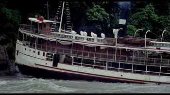Movie still from “My Best Fiend” (1999), directed by Werner Herzog – A large boat floating on top of a body of water; Extreme Wide shot, High angle