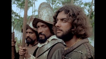 Movie still from “My Best Fiend” (1999), directed by Werner Herzog – A group of men standing next to each other; Close Up shot, Low angle