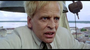 Movie still from “My Best Fiend” (1999), directed by Werner Herzog – A person wearing a suit and tie; Close Up shot, Low angle