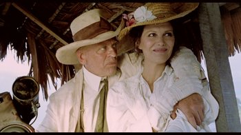 Movie still from “My Best Fiend” (1999), directed by Werner Herzog – An older man and a younger woman wearing hats; Close Up shot, Low angle