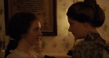 Movie still from “My Brilliant Career” (1979), directed by Gillian Armstrong – Two women looking at each other in a room; Close Up shot, Over the shoulder angle