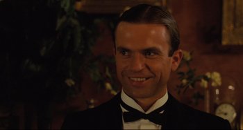 Movie still from “My Brilliant Career” (1979), directed by Gillian Armstrong – A person wearing a suit and bow tie; Close Up shot, Low angle