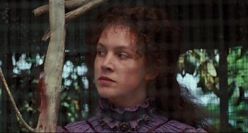 Movie still from “My Brilliant Career” (1979), directed by Gillian Armstrong – A person with curly hair wearing a dress; Close Up shot, Low angle