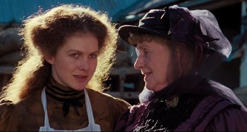 Movie still from “My Brilliant Career” (1979), directed by Gillian Armstrong – A woman and an older woman standing next to each other; Close Up shot, Over the shoulder angle