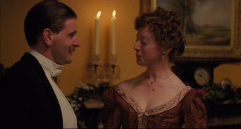 Movie still from “My Brilliant Career” (1979), directed by Gillian Armstrong – A man and a woman dressed in period clothing; Medium shot, Low angle