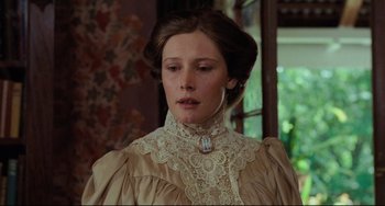 Movie still from “My Brilliant Career” (1979), directed by Gillian Armstrong – A young woman in a victorian era dress looking down; Close Up shot, Low angle