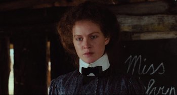 Movie still from “My Brilliant Career” (1979), directed by Gillian Armstrong – A woman with a bow tie and a dress; Close Up shot, Low angle