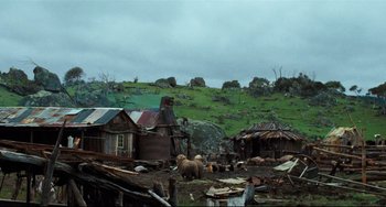 Movie still from “My Brilliant Career” (1979), directed by Gillian Armstrong – A group of animals standing on top of a grass covered field; Extreme Wide shot, High angle