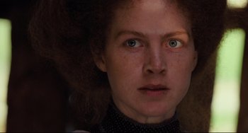 Movie still from “My Brilliant Career” (1979), directed by Gillian Armstrong – A person's face with green eyes; Close Up shot, Low angle