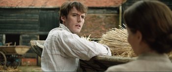 Movie still from “My Cousin Rachel” (2017), directed by Roger Michell – A man holding a bunch of sticks in his hands; Close Up shot, Over the shoulder angle