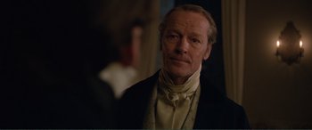 Movie still from “My Cousin Rachel” (2017), directed by Roger Michell – A person wearing a suit and a tie; Close Up shot, Over the shoulder angle