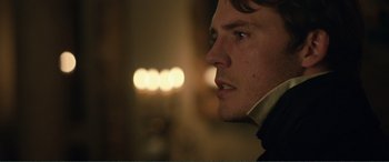 Movie still from “My Cousin Rachel” (2017), directed by Roger Michell – A man's face in a dark room; Close Up shot, Over the shoulder angle