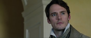 Movie still from “My Cousin Rachel” (2017), directed by Roger Michell – A person wearing a jacket; Close Up shot, Over the shoulder angle