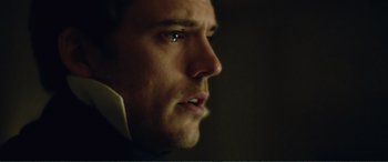 Movie still from “My Cousin Rachel” (2017), directed by Roger Michell – A man's face in the dark; Extreme Close Up shot, Over the shoulder angle