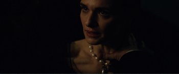 Movie still from “My Cousin Rachel” (2017), directed by Roger Michell – A person wearing a pearl necklace; Close Up shot, Over the shoulder angle
