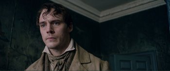 Movie still from “My Cousin Rachel” (2017), directed by Roger Michell – A person wearing a jacket; Close Up shot, Over the shoulder angle