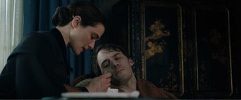 Movie still from “My Cousin Rachel” (2017), directed by Roger Michell – A man and a woman sitting on a couch; Close Up shot, Over the shoulder angle