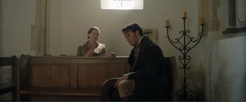 Movie still from “My Cousin Rachel” (2017), directed by Roger Michell – A man and a woman sitting in front of each other; Medium shot, Low angle