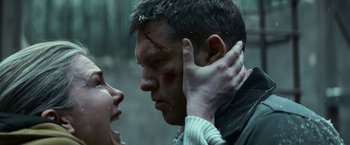 Movie still from “Fractured” (2019), directed by Brad Anderson – A man and a woman with blood on their face; Close Up shot, Low angle