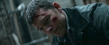 Movie still from “Fractured” (2019), directed by Brad Anderson – A person with blood on his face; Close Up shot, Low angle