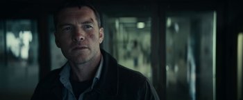 Movie still from “Fractured” (2019), directed by Brad Anderson – A person wearing a black jacket; Close Up shot, Low angle