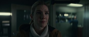 Movie still from “Fractured” (2019), directed by Brad Anderson – A person wearing a jacket and looking at the camera; Close Up shot, Over the shoulder angle