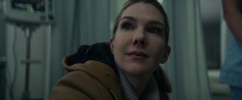 Movie still from “Fractured” (2019), directed by Brad Anderson – A person wearing a jacket; Close Up shot, Low angle