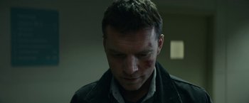 Movie still from “Fractured” (2019), directed by Brad Anderson – A person with a bruise on his face; Close Up shot, Low angle