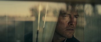 Movie still from “Fractured” (2019), directed by Brad Anderson – A person looking out a window; Close Up shot, Low angle