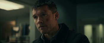 Movie still from “Fractured” (2019), directed by Brad Anderson – A person wearing a jacket; Close Up shot, Over the shoulder angle