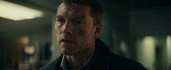 Movie still from “Fractured” (2019), directed by Brad Anderson – A person wearing a jacket; Close Up shot, Low angle