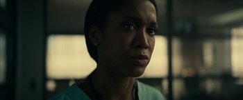 Movie still from “Fractured” (2019), directed by Brad Anderson – A person wearing a blue shirt; Close Up shot, Low angle
