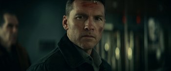 Movie still from “Fractured” (2019), directed by Brad Anderson – A person wearing a jacket; Close Up shot, Low angle