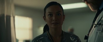 Movie still from “Fractured” (2019), directed by Brad Anderson – A person wearing a shirt; Close Up shot, Over the shoulder angle