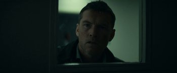 Movie still from “Fractured” (2019), directed by Brad Anderson – A person looking at a mirror; Close Up shot, Low angle