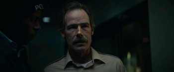 Movie still from “Fractured” (2019), directed by Brad Anderson – A person wearing a shirt; Close Up shot, Low angle