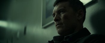 Movie still from “Fractured” (2019), directed by Brad Anderson – A person looking at the camera; Close Up shot, Low angle