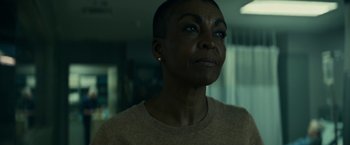 Movie still from “Fractured” (2019), directed by Brad Anderson – A person wearing a sweater; Close Up shot, Over the shoulder angle