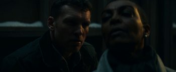 Movie still from “Fractured” (2019), directed by Brad Anderson – A man and a woman looking at each other in the dark; Close Up shot, Low angle