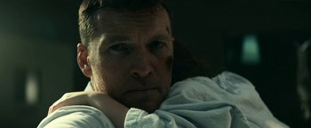 Movie still from “Fractured” (2019), directed by Brad Anderson – A person laying in a bed; Close Up shot, Low angle