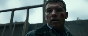 Movie still from “Fractured” (2019), directed by Brad Anderson – A person with a knife on his face; Close Up shot, Low angle