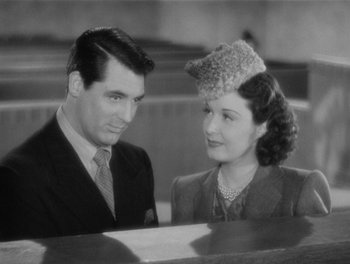 Movie still from “My Favorite Wife” (1940), directed by Garson Kanin – A man and a woman sitting next to each other in front of a piano; Close Up shot, High angle