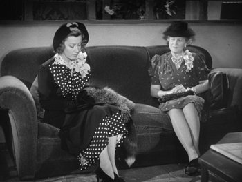 Movie still from “My Favorite Wife” (1940), directed by Garson Kanin – Two women sitting on a couch in a living room; Medium shot, High angle