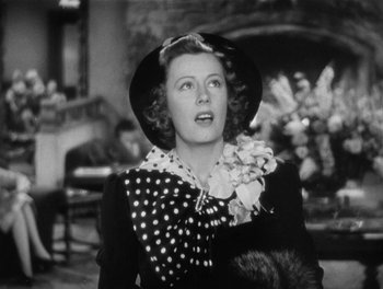 Movie still from “My Favorite Wife” (1940), directed by Garson Kanin – An old photo of a woman wearing a polka dot hat; Close Up shot, Low angle