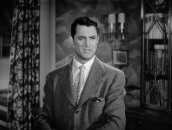 Movie still from “My Favorite Wife” (1940), directed by Garson Kanin – Black and white photograph of a man in a suit and tie; Close Up shot, Over the shoulder angle