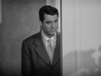 Movie still from “My Favorite Wife” (1940), directed by Garson Kanin – Black and white photograph of a man in a suit; Medium shot, Over the shoulder angle