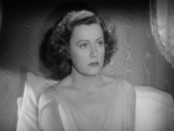 Movie still from “My Favorite Wife” (1940), directed by Garson Kanin – An old black and white photo of a woman; Close Up shot, High angle