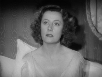 Movie still from “My Favorite Wife” (1940), directed by Garson Kanin – An old photo of an older woman with curly hair; Close Up shot, High angle